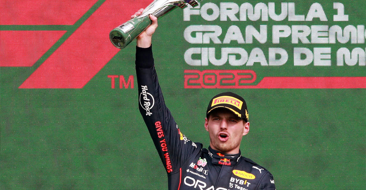 motor-main Red Bull's Max Verstappen celebrates on the podium after winning the race and setting a new F1 record of 14 grand prix wins in a season. Photo: REUTERS
