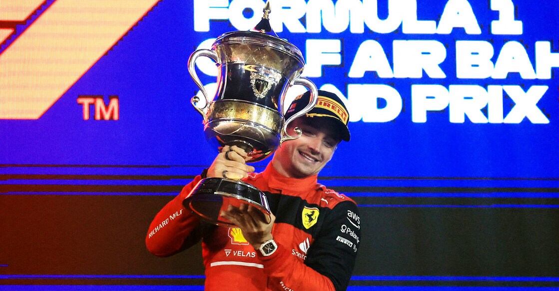 Ferrari's Charles Leclerc celebrates on the podium. Photo: Reuters/Thaier Al-Sudani