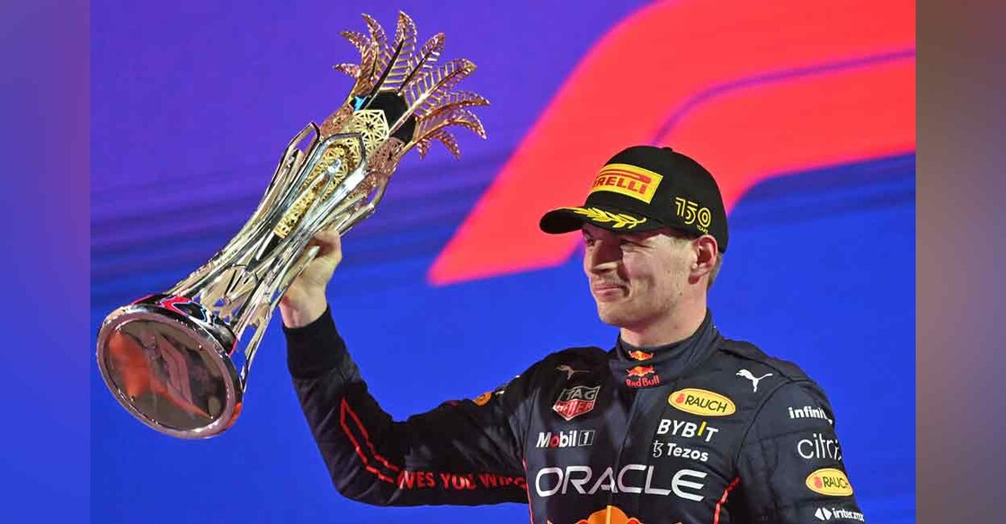 Red Bull's Dutch driver Max Verstappen raises his 1st-place trophy on the podium after winning the Saudi Arabia Formula One Grand Prix at the Jeddah Corniche Circuit on Sunday. Photo: AFP