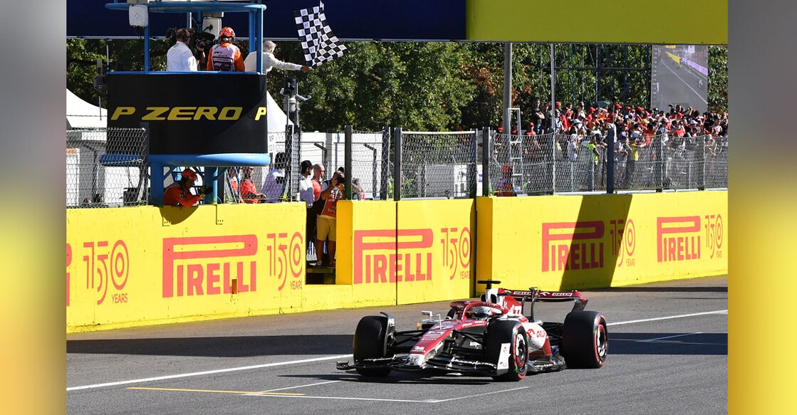 Red Bull's Max Verstappen crosses the line to win the race. Photo: Reuters/ Jennifer Lorenzini