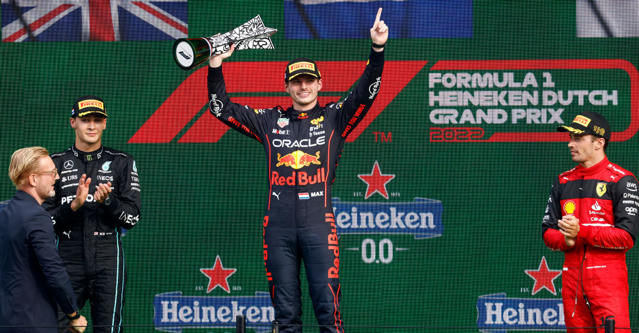 MOTOR-F1-NETHERLANDS Red Bull's Max Verstappen celebrates on the podium with the trophy after winning the Dutch Grand Prix. Photo: Reuters/ Yves Herman