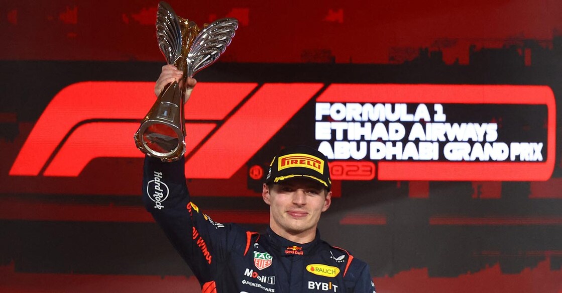 Red Bull's Max Verstappen celebrates with the trophy on the podium. Photo: Reuters/Rula Rouhana