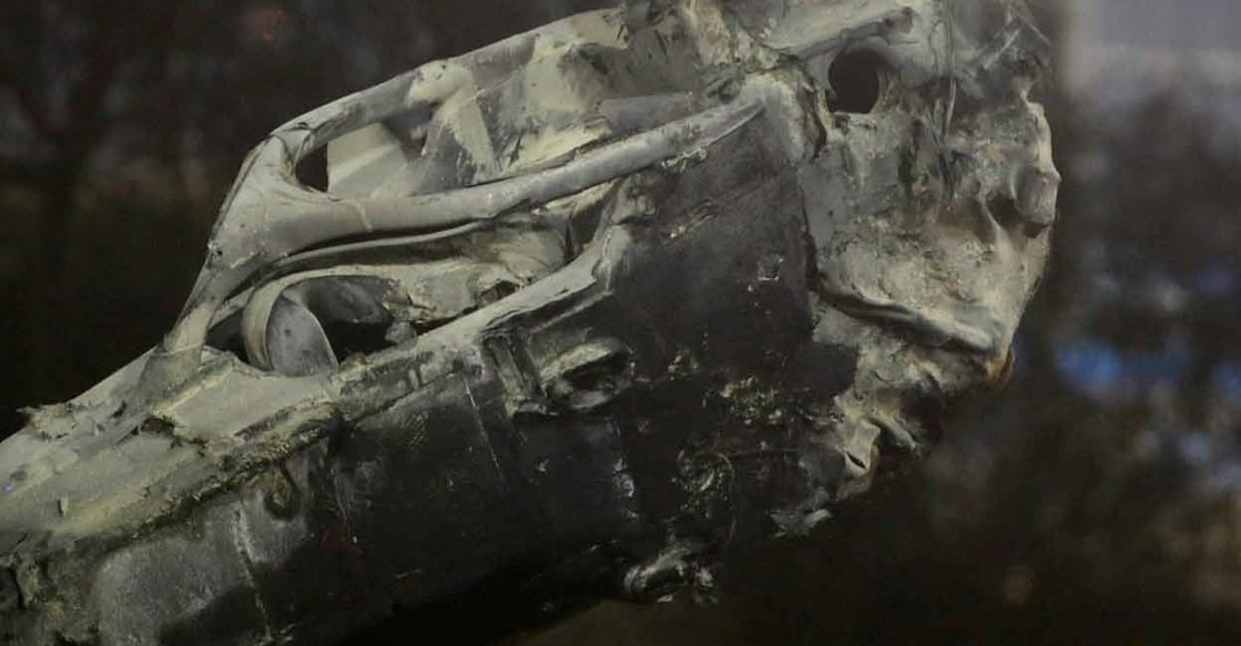 General view as the burnt wreckage of the car of Haas' Romain Grosjean is removed from the track following a crash. File photo: Pool via Reutes/Hamad I Mohammed