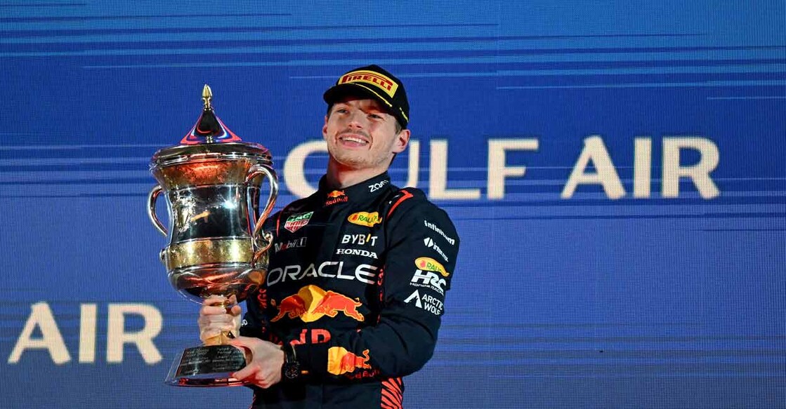 Red Bull Racing's Dutch driver Max Verstappen celebrates with the winner's trophy on the podium after the Bahrain Formula One Grand Prix at the Bahrain International Circuit in Sakhir on Sunday. Photo: AFP/Andrej Isakovic
