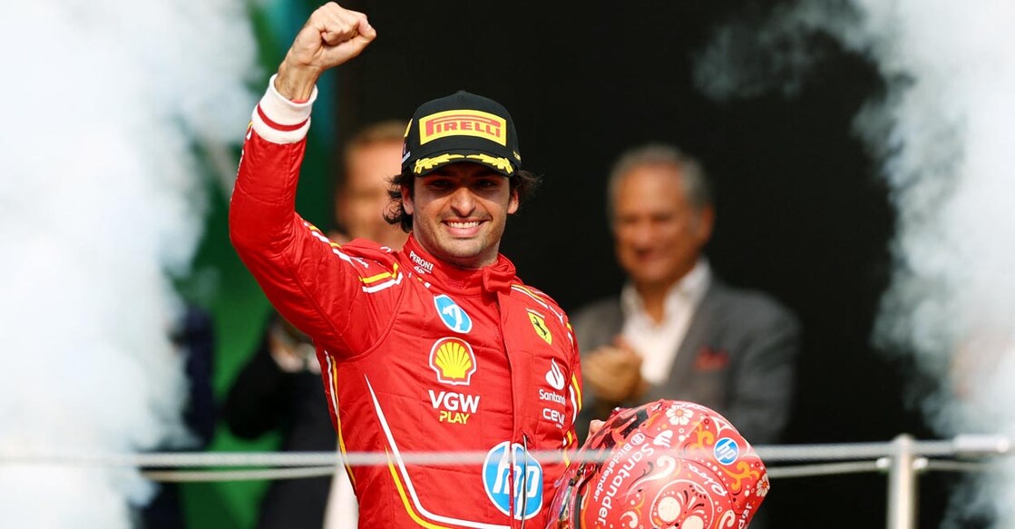 Ferrari's Carlos Sainz celebrates on the podium. Photo: Reuters/Raquel Cunha