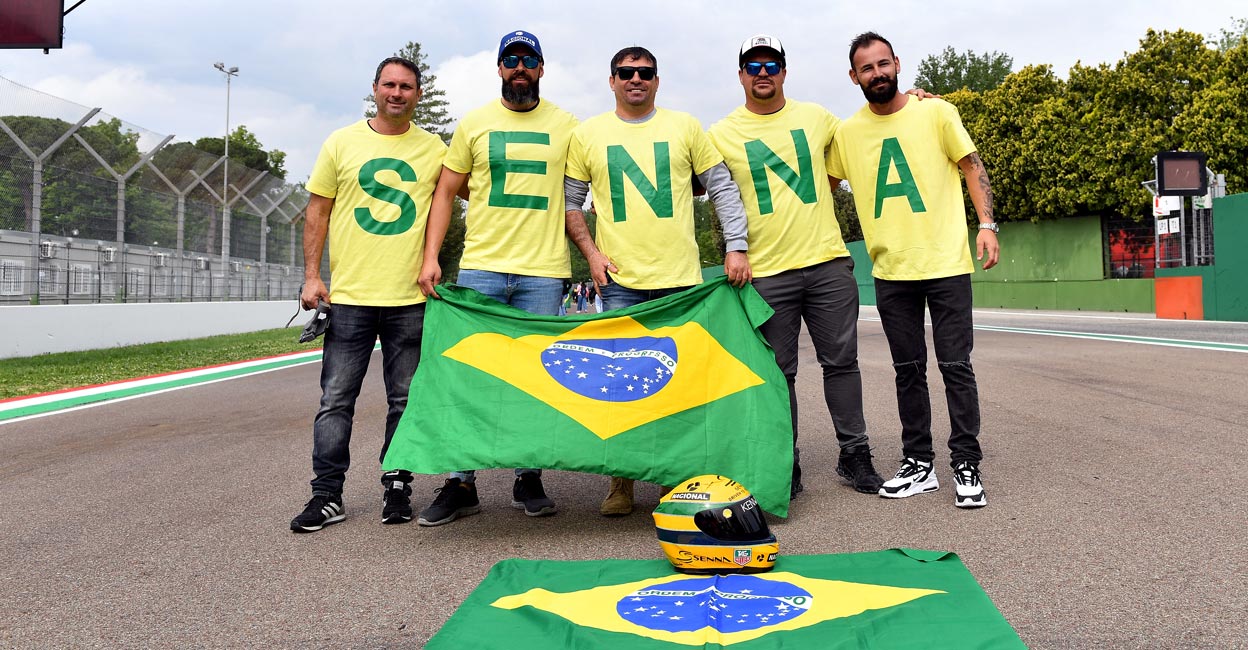 Fans of Ayrton Senna pose on the Imola track on his 30th death anniversary. Photo: Reuters/Jennifer Lorenzini