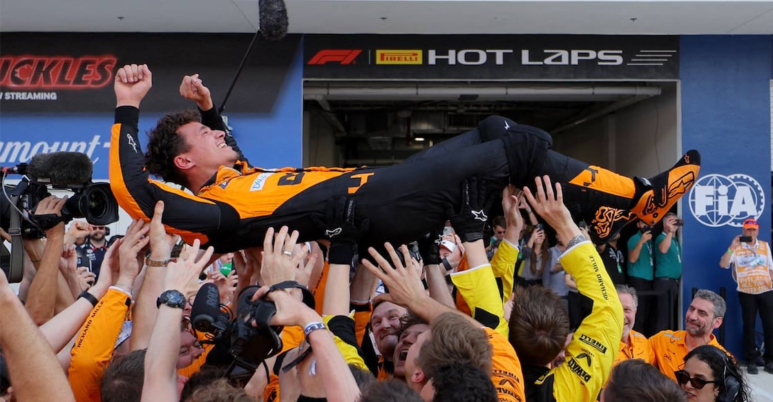 McLaren's Lando Norris is thrown in the air by his team as he celebrates winning the Miami Grand Prix. Photo: Reuters. 