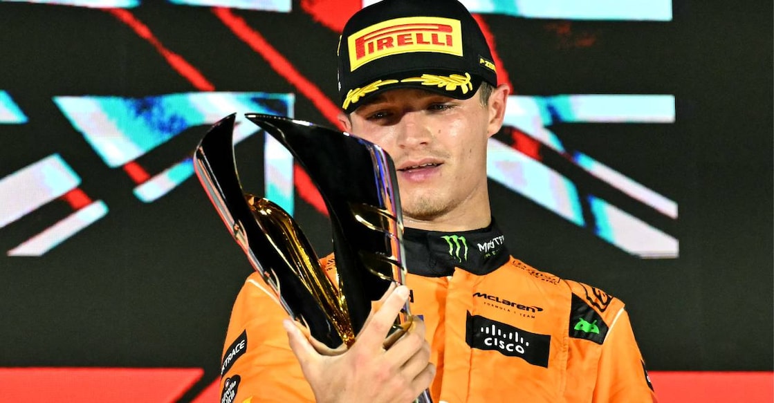 McLaren's British driver Lando Norris celebrates winning on the podium after the Formula One Singapore Grand Prix night race at the Marina Bay Street Circuit in Singapore. Photo: AFP