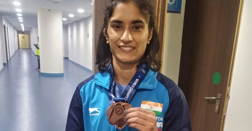 Vinesh locks Olympic quota with bronze at Worlds, Pooja in line for ...