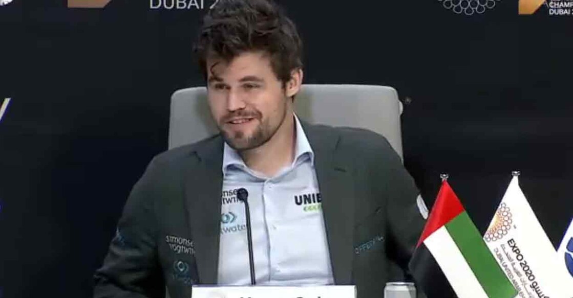 Magnus Carlsen reacts during the press conference in Dubai after retaining his title. Screengrab/FIDE