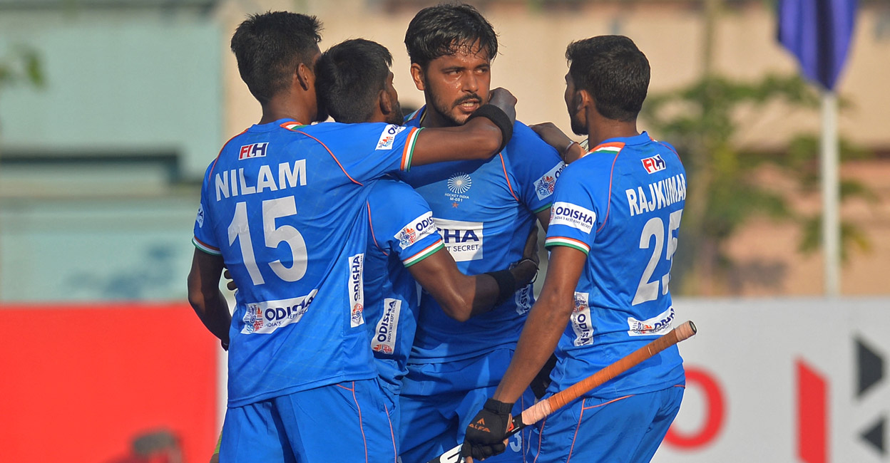 Indian players celebrate scoring a goal against Pakistan. Photo: AFP/Munir Uz Zaman 