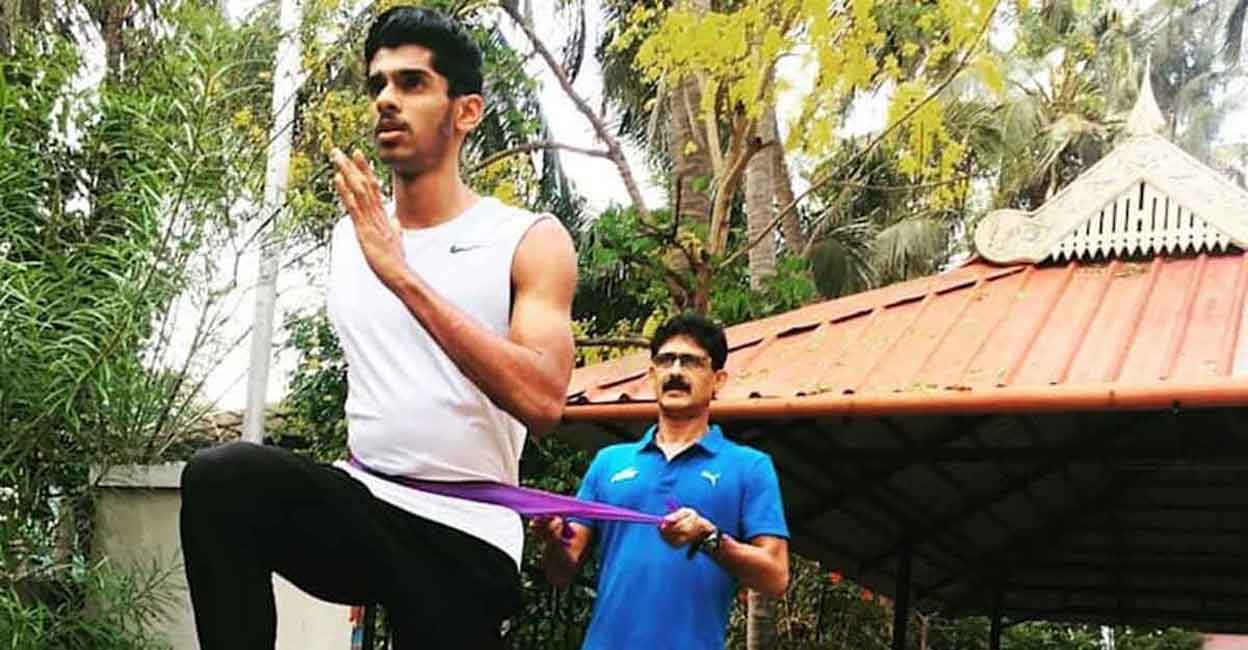M Sreeshankar trains under the watchful eyes of his father Murali. File photo: IANS