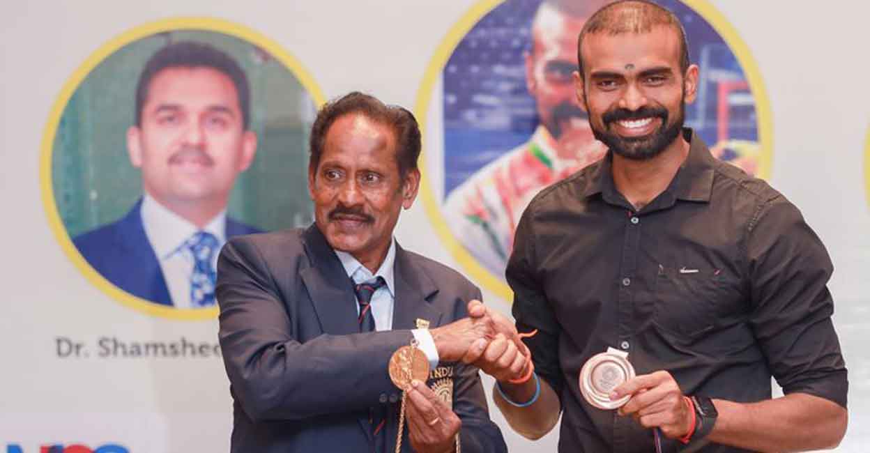 Fredericks & Sreejesh Manuel Fredericks and P R Sreejesh display their Olympic medals at a function in Kochi on August 12, 2021. Photo: By Special Arrangement