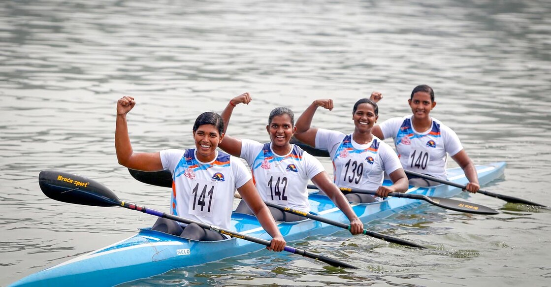 Kerala team members celebrate after winning the gold medal in canoeing 500m sprint event. File photo: PTI