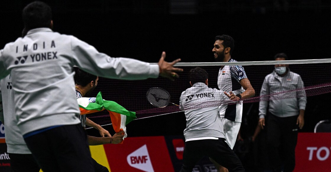 H S Prannoy Indian team members rush in to congratulate H S Prannoy, right, after his win over Rasmus Gemke. Photo: AFP/Lillian Suwanrumpha