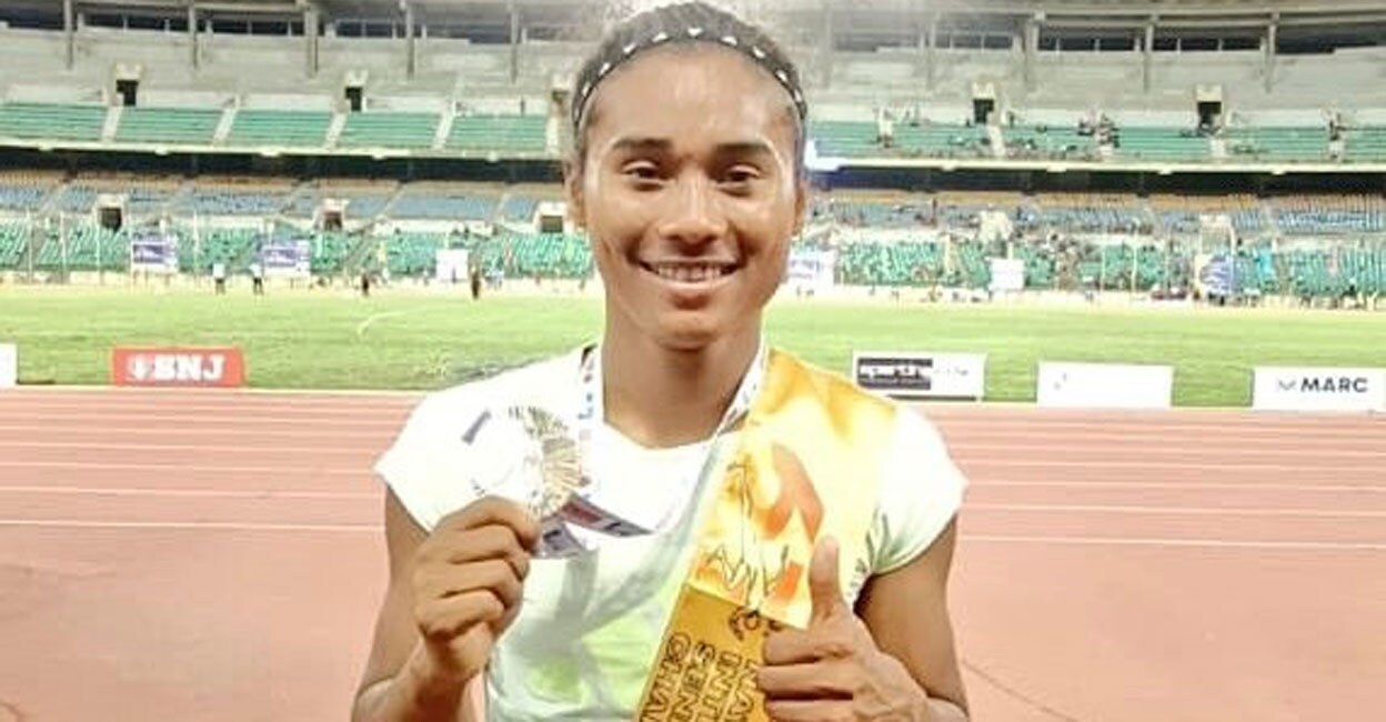 Hima Das Hima Das poses after winning women's 100m. Photo: Twitter/ @afiindia