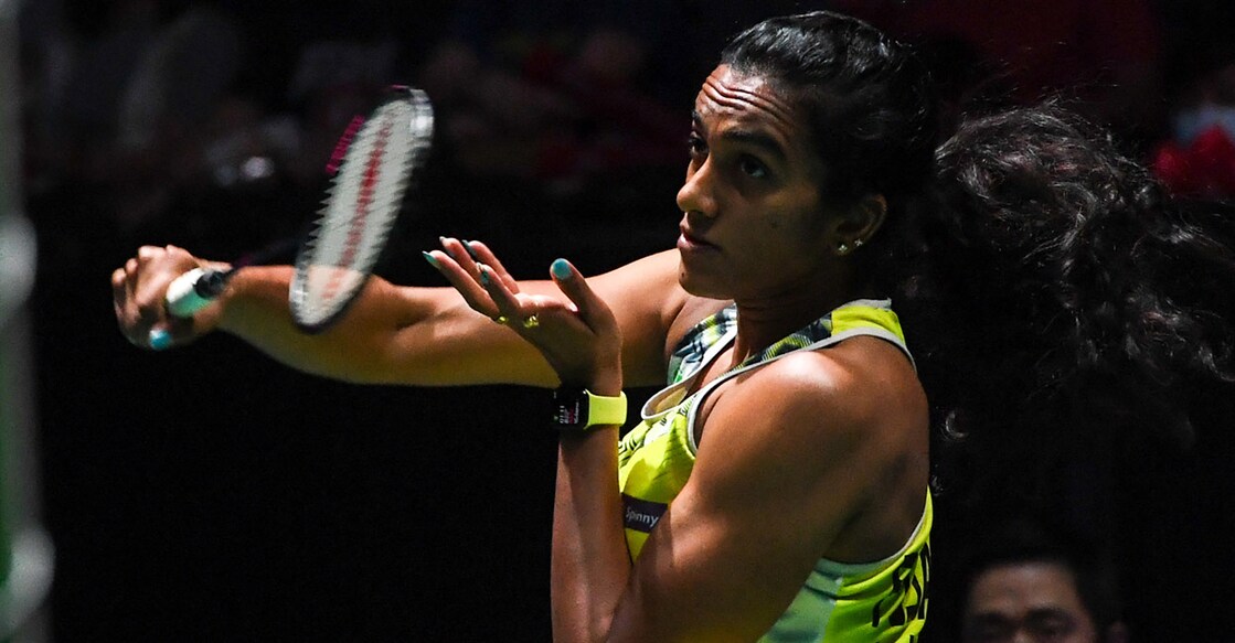 P V Sindhu in action in the final. Photo: AFP/Rosian Rahman