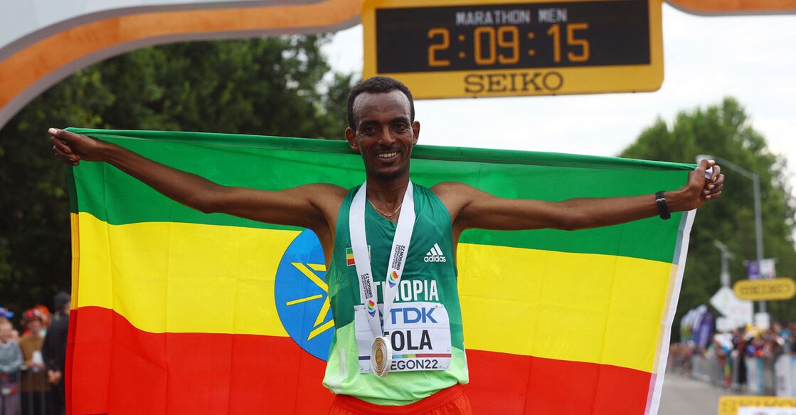 Ethiopia's Tamirat Tola celebrates winning the men's marathon and setting a new world championship record. Photo: Reuters/ Brian Snyder