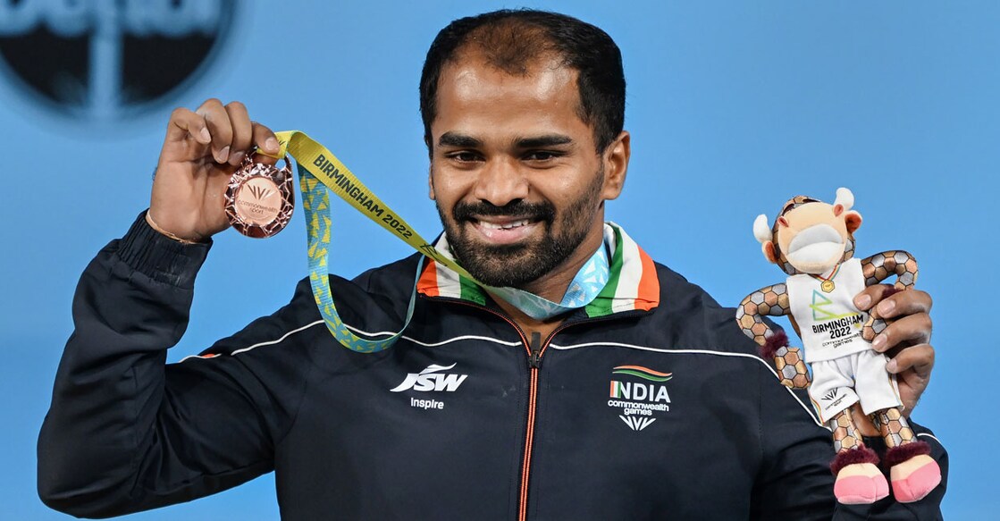 India's Gururaja Poojary poses with the bronze medal from men's 61kg weightlifting event at the Commonwealth Games 2022 (CWG) in Birmingham on Saturday. Photo: PTI