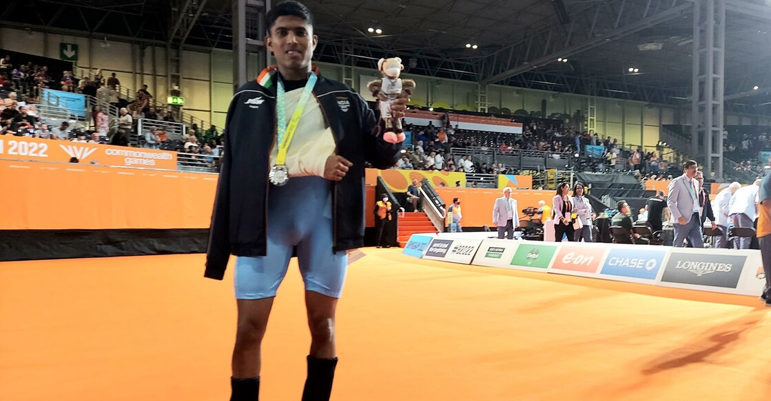 Sanket Sargar poses with the medal. Photo: Twitter@WeAreTeamIndia