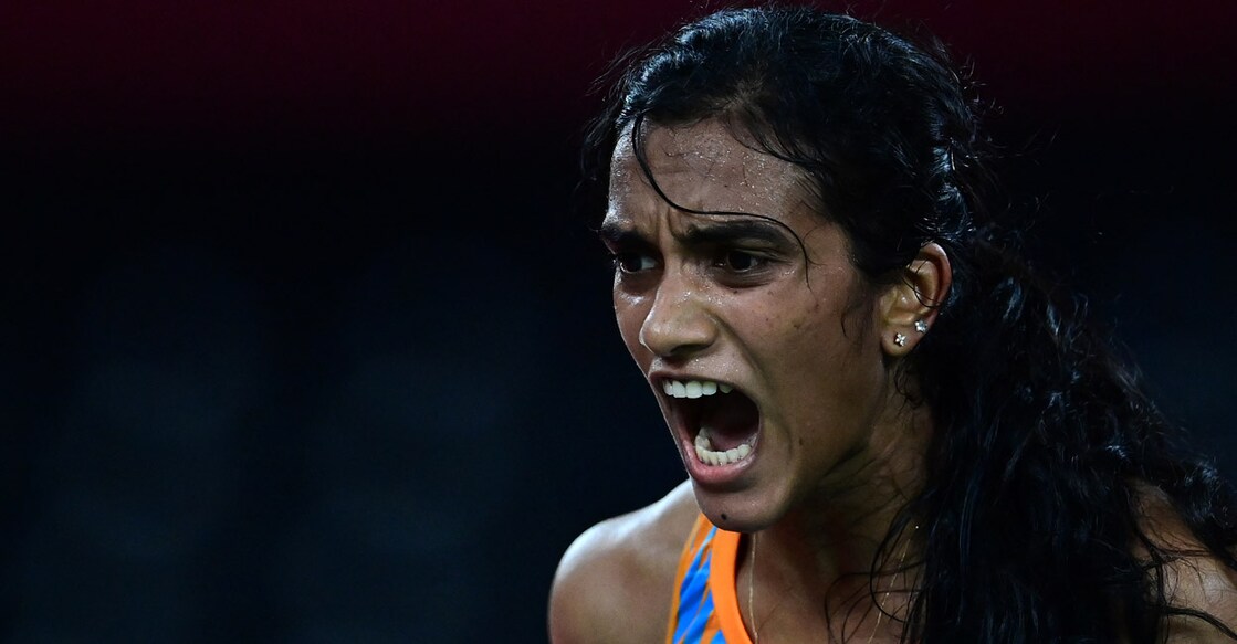 P V Sindhu reacts after winning a point against He Bingjiao in the bronze medal play-off at Tokyo 2020. File photo: AFP/Pedro Pardo