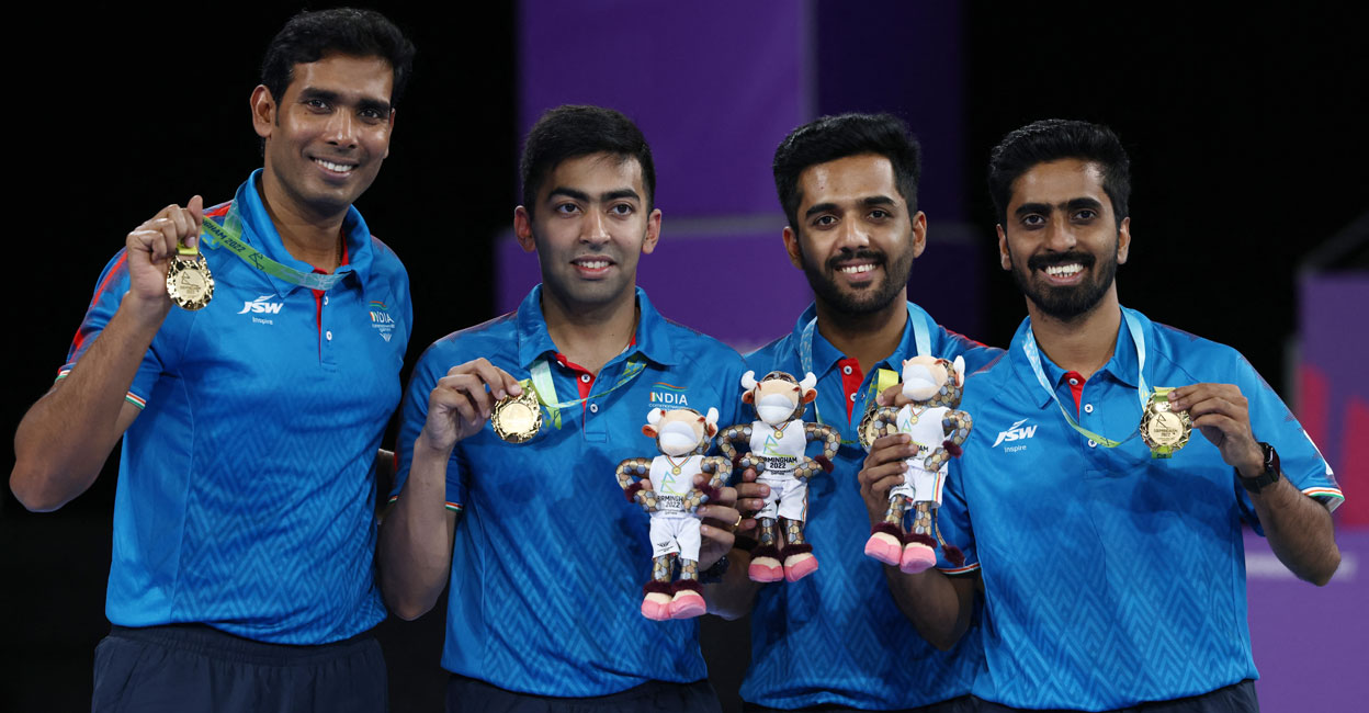 Gold medallists, India's Sharath Kamal Achanta (from L), Harmeet Desai, Sanil Shetty, and Sathiyan Gnanasekaran pose with their gold medals during the medal presentation ceremony for the Men's Team Table Tennis of the Commonwealth Games at the NEC Arena in Birmingham on Tuesday. Photo: AFP/ Darren Staples 