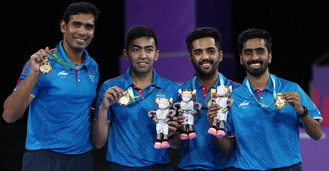 Gold medallists, India's Sharath Kamal Achanta (from L), Harmeet Desai, Sanil Shetty, and Sathiyan Gnanasekaran pose with their gold medals during the medal presentation ceremony for the Men's Team Table Tennis of the Commonwealth Games at the NEC Arena in Birmingham on Tuesday. Photo: AFP/ Darren Staples 