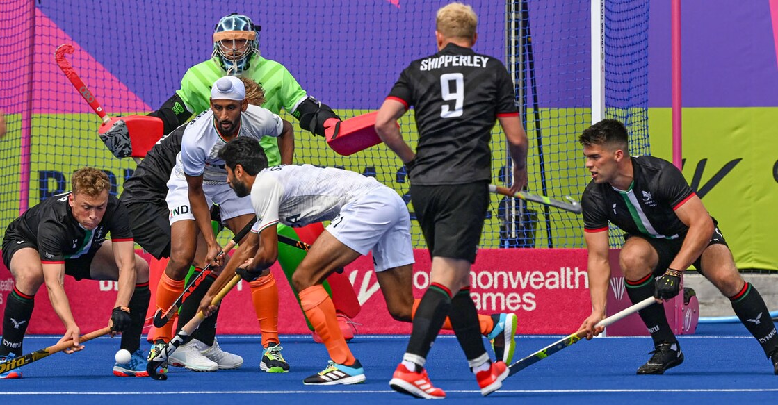 India (white) in action against Wales during the Pool B match of the Commonwealth Games, at the University of Birmingham Hockey and Squash Centre in Birmingham on Thursday. Photo: PTI