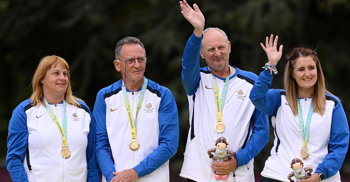 George Miller, second left, became the oldest Commonwealth Games gold medallist, winning the B2/B3 mixed pairs bowls. Photo: Twitter@birminghamcg22
