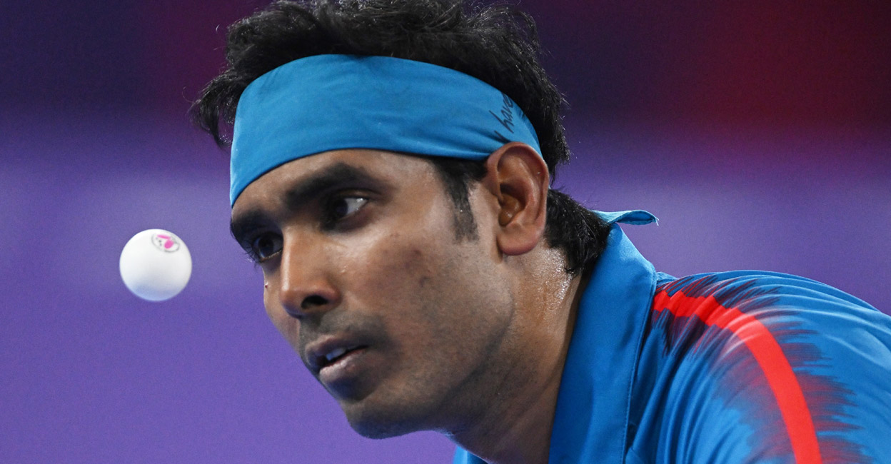 Sharath Kamal in action against Liam Pitchford in the final. Photo: AFP/Andy Buchanan 