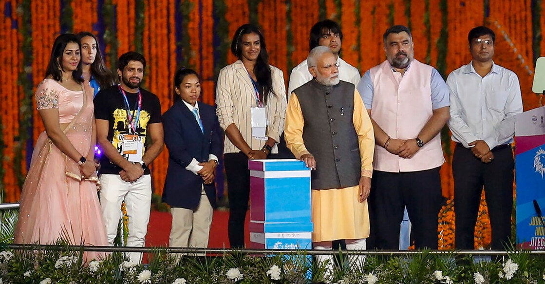 Prime Minister Narendra Modi with sportspersons during the inauguration of 36th National Games in Ahmedabad on Thursday. Photo: PTI