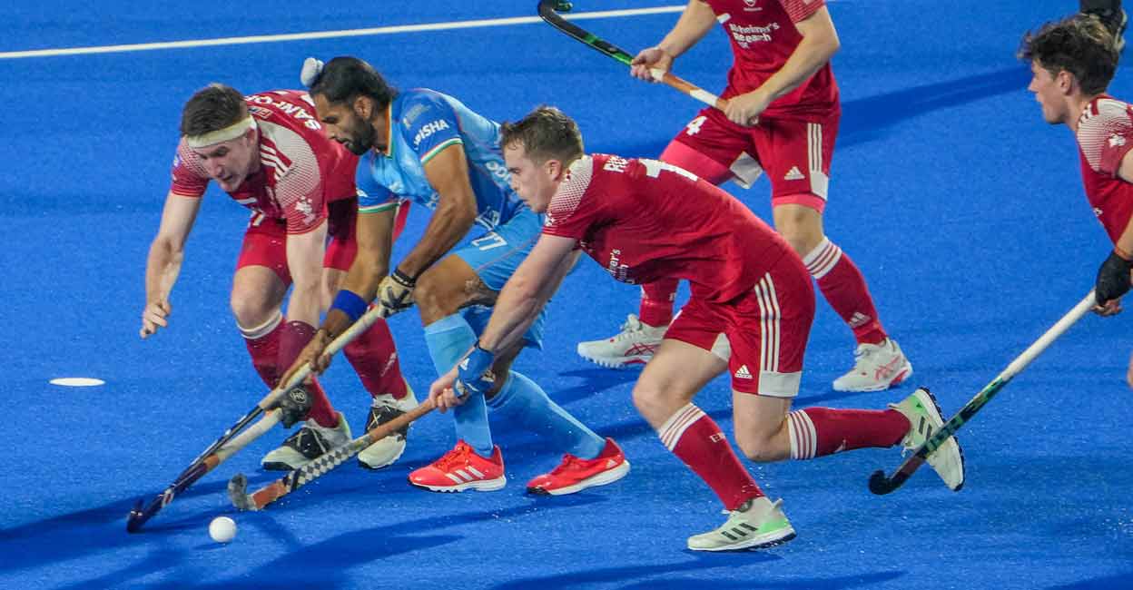 PTI01_15_2023_000352B England players try to stop Akashdeep Singh (27) of India during Men' Hockey World Cup 2023 at Birsa Munda Stadium, in Rourkela, Odisha on Sunday. Photo: PTI