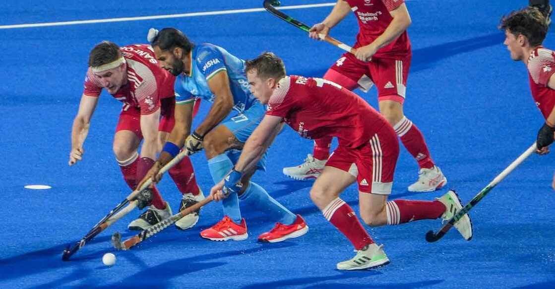 England players try to stop Akashdeep Singh (27) of India during Men' Hockey World Cup 2023 at Birsa Munda Stadium, in Rourkela, Odisha on Sunday. Photo: PTI
