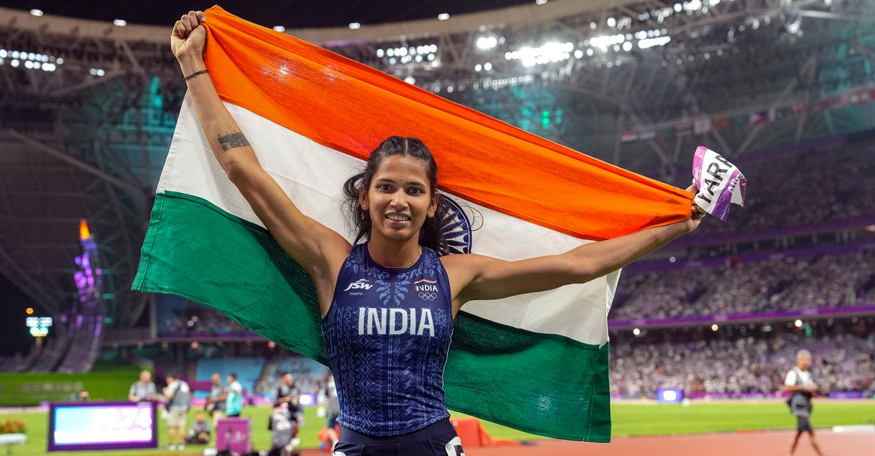 Jyothi Yarraji celebrates after winning silver medal in 100m hurdles. Photo: PTI/Shailendra Bhojak