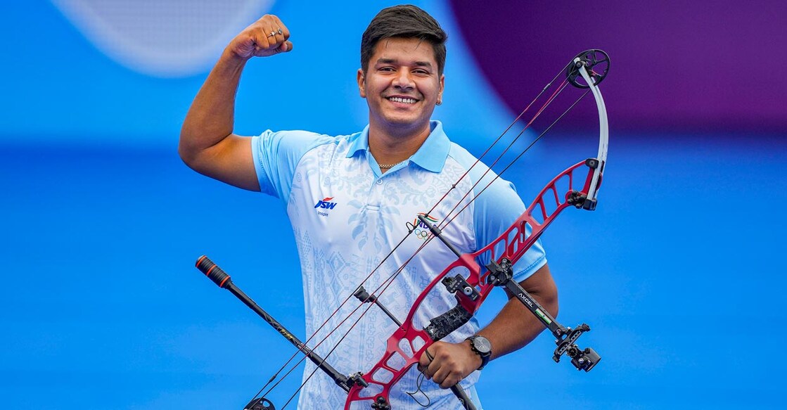 Abhishek Verma celebrates his win over South Korea's Jaehoon Joo. Photo: PTI/Shailendra Bhojak