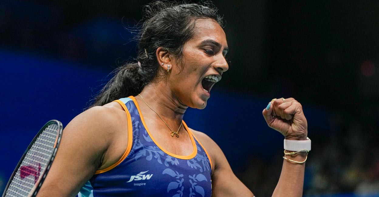 P V Sindhu exults after winning a point. Photo: PTI/Gurinder Osan