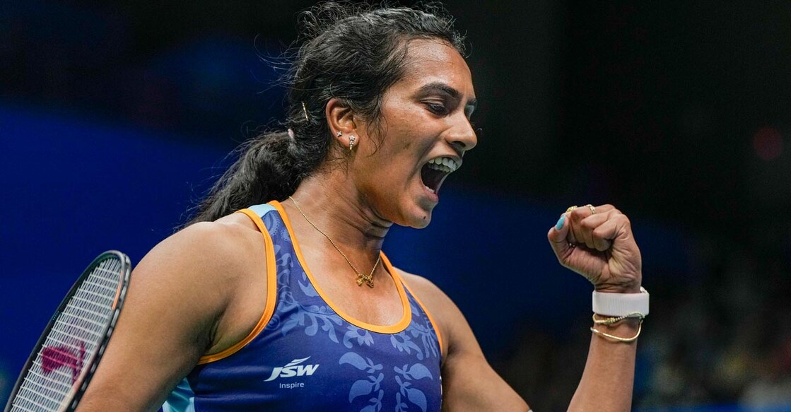 P V Sindhu exults after winning a point. Photo: PTI/Gurinder Osan