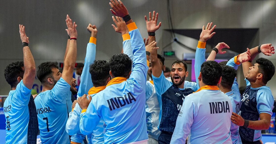 Indian team members celebrate their win over Pakistan. Photo: PTI/Shailendra Bhoja)