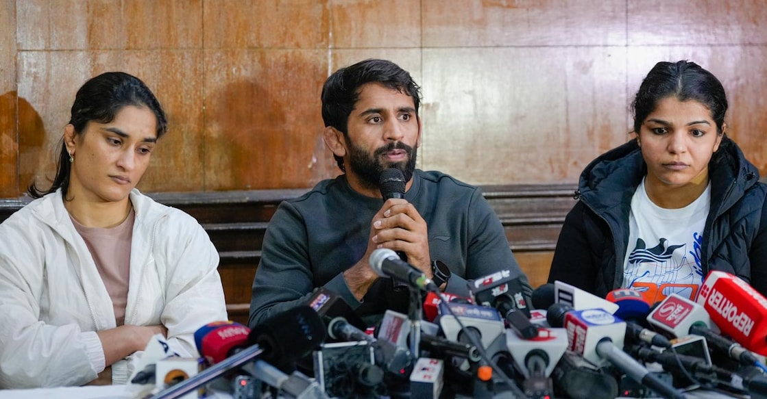 From left: Vinesh Phogat, Bajrang Punia and Sakshi Malik address a press conference in New Delhi Thursday. Photo: PTI/Vijay Verma
