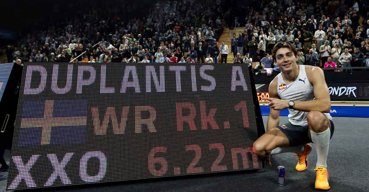 Armand Duplantis poses for a photograph as he celebrates after setting the new world record. Photo: AFP/Arnaud Finistre