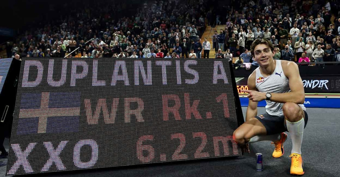 Armand Duplantis poses for a photograph as he celebrates after setting the new world record. Photo: AFP/Arnaud Finistre