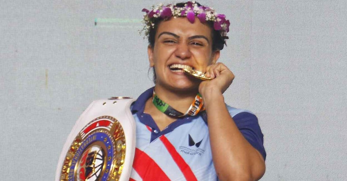 Saweety Boora celebrates with her gold medal. Photo: IANS