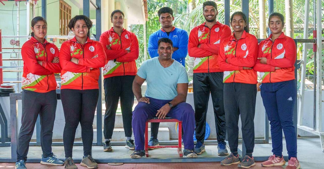 Gireesh KC with his sons and athletes at KC Throws Academy at Cheruvathur in Kasaragod district. Photo: Rahul Rakav