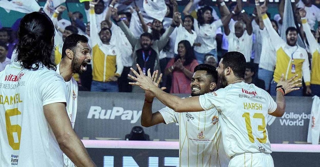 Ahmedabad Defenders' players celebrate a point during the final against Bengaluru Torpedoes at the Regional Sports Centre in Kochi on Sunday. Photo: PVL
