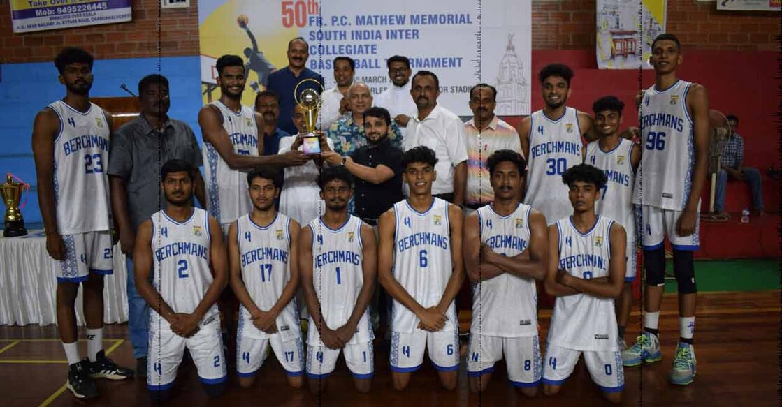 Players of SB College, Changanacherry pose with the trophy. Photo: Special arrangement 