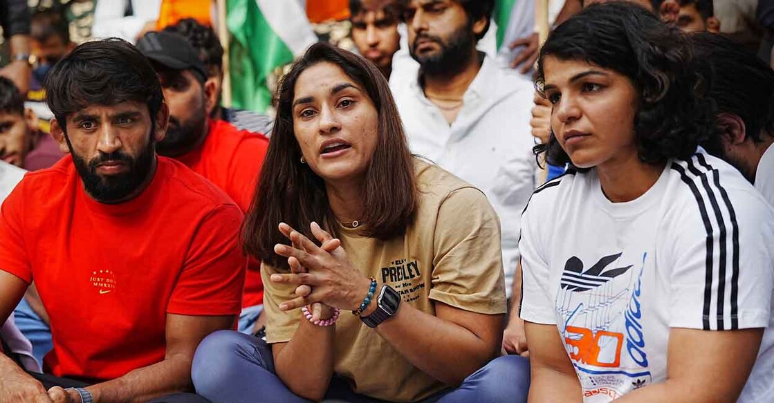Bajrang Punia, Vinesh Phogat and Sakshi Malik during a press conference at Jantar Mantar in New Delhi on Sunday. Photo: PTI/Manvender Vashist Lav