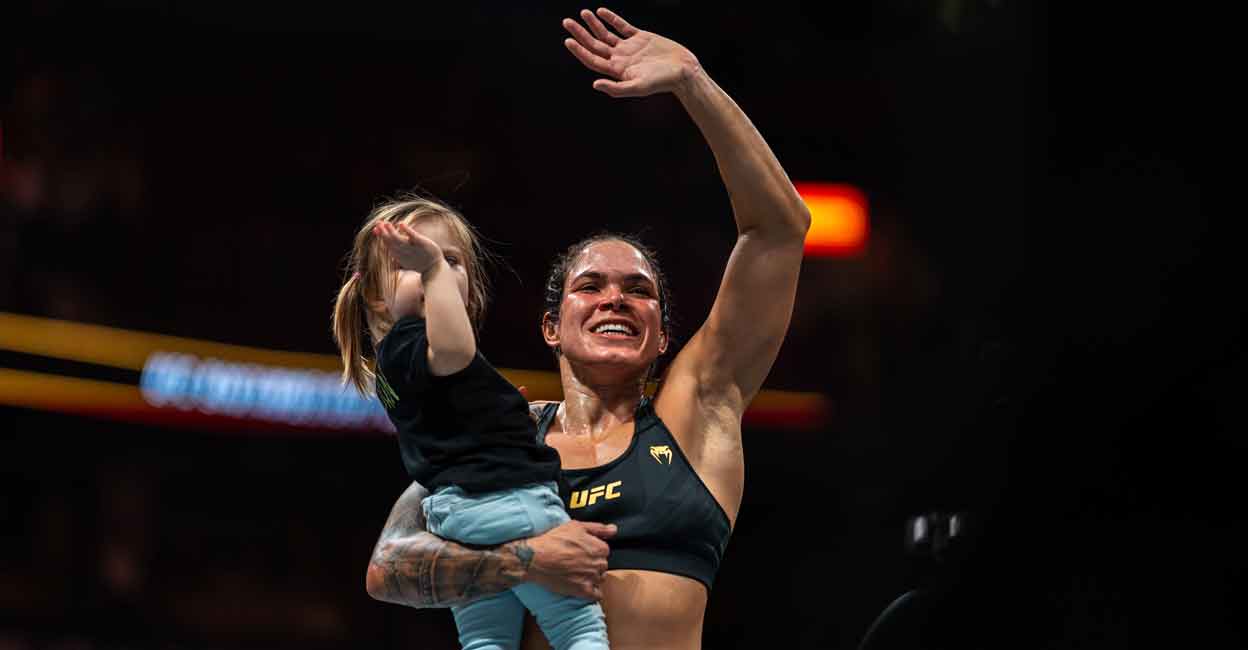 Amanda Nunes with her baby after announcing her retirement in Vancouver on Saturday. Photo: AFP/Jordan Jones