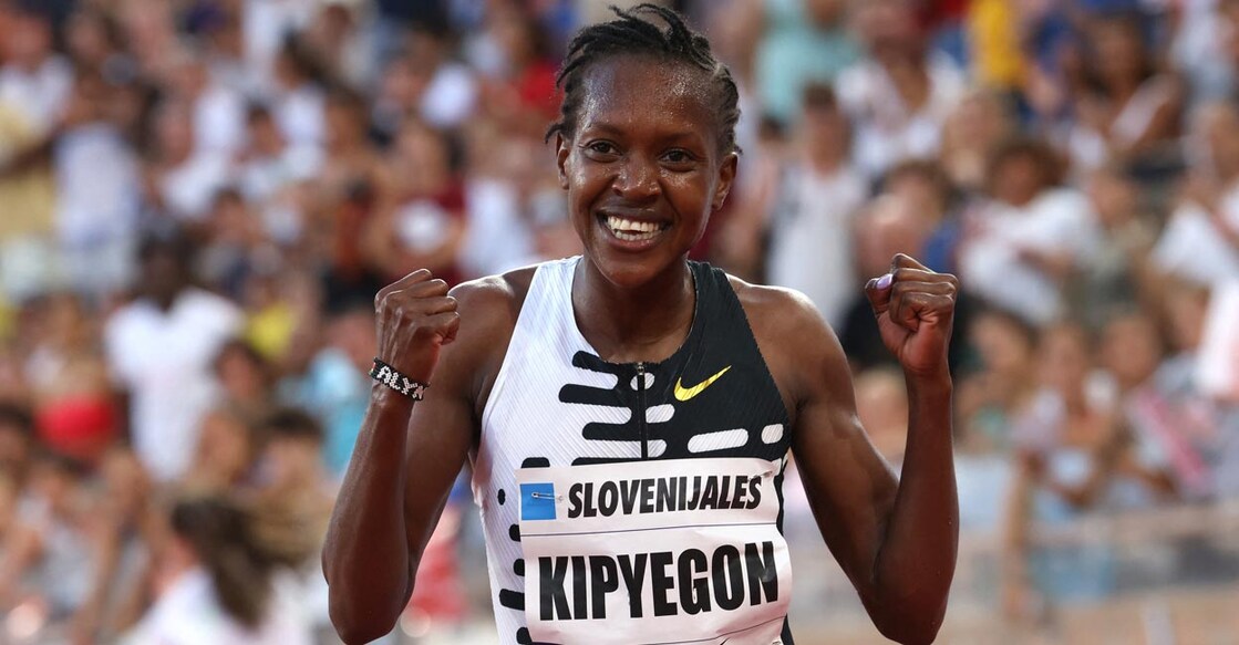 Faith Kipyegon celebrates after setting the new world record. Photo: Reuters/Claudia Greco