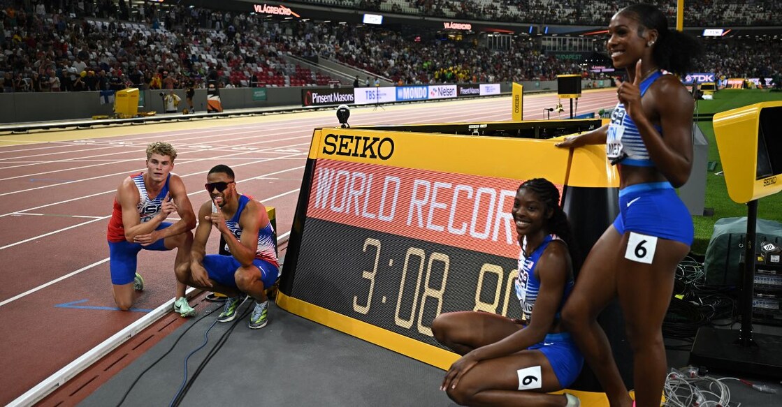 Matthew Boling, Justin Robinson, Alexis Holmes and Rosey Effiong of the US celebrate after winning the mixed 4x400 metres relay final and setting a new world record. Photo: Reuters/Dylan Martinez