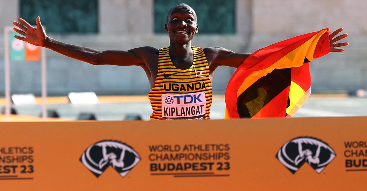 Victor Kiplangat Victor Kiplangat crosses the finishing line. Photo: Reuters/Bernadett Szabo